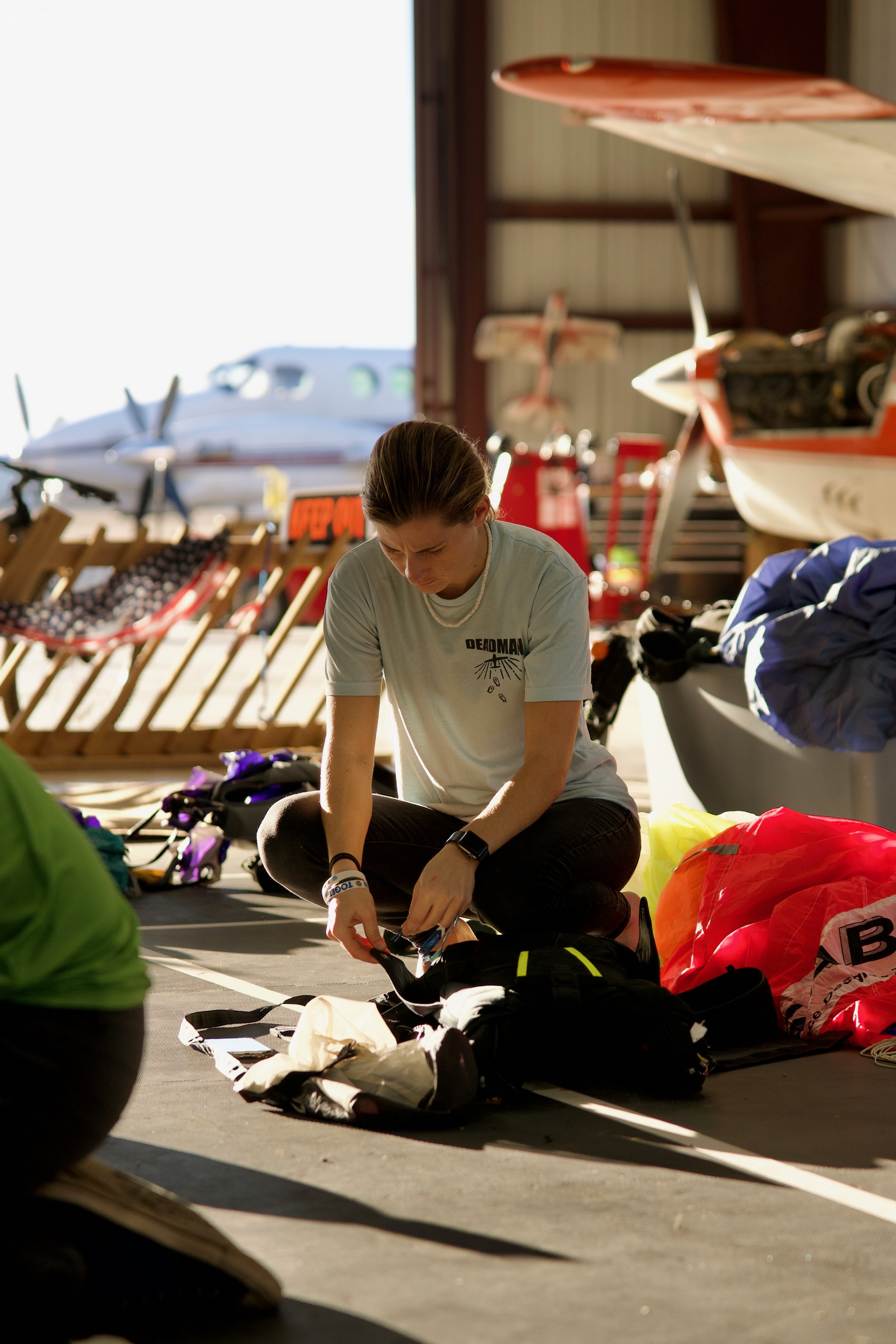 Packing parachute in the hangar — the work behind the jump